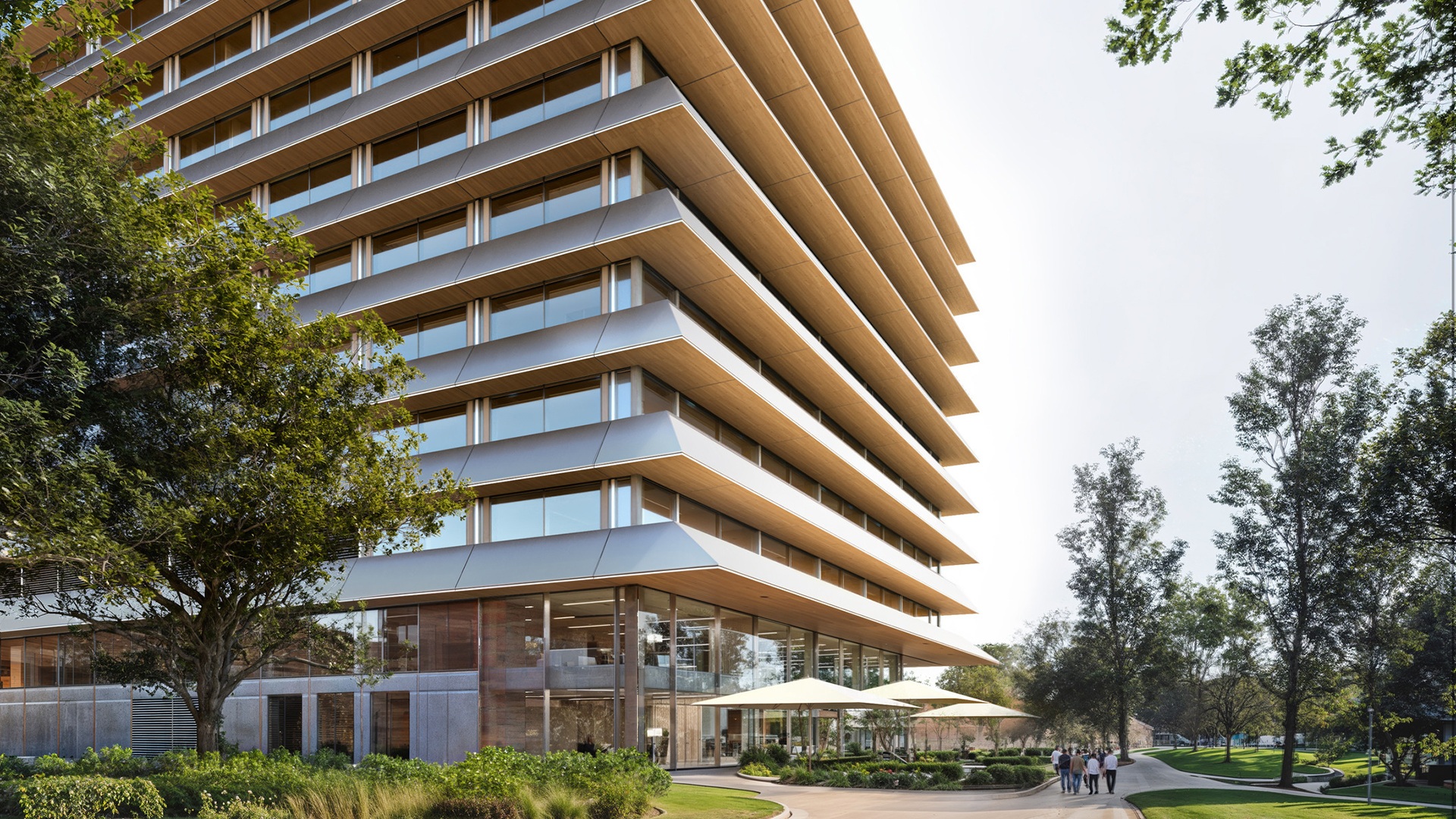 Eine mehrstöckige Hightech-Forschungseinrichtung mit weiten Überhängen, nachhaltigem Design und landschaftlich gestalteten Außenanlagen zur Förderung wissenschaftlicher Innovationen.